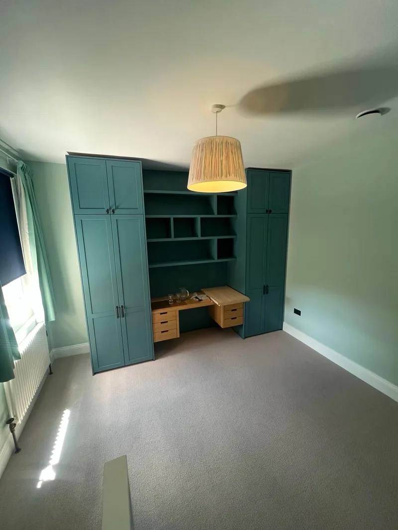 Bespoke teal desk and wardrobe wall unit