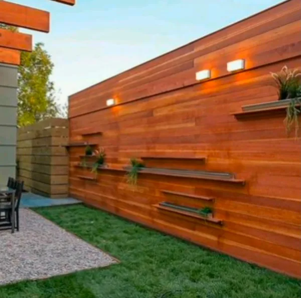 Wood panel wall with floating shelves and lights