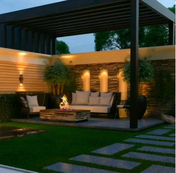 Outdoor seating area under a pergola with a firepit and lights