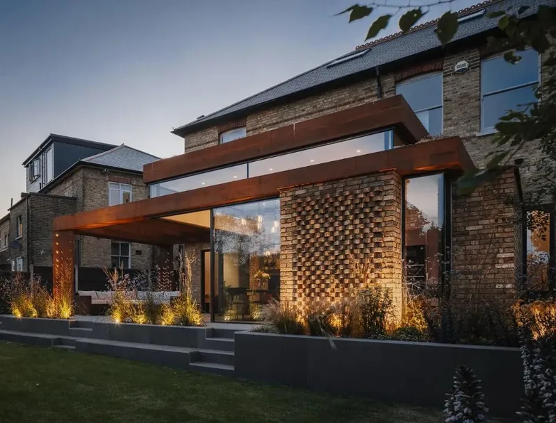 Modern brick and wood home extension close-up