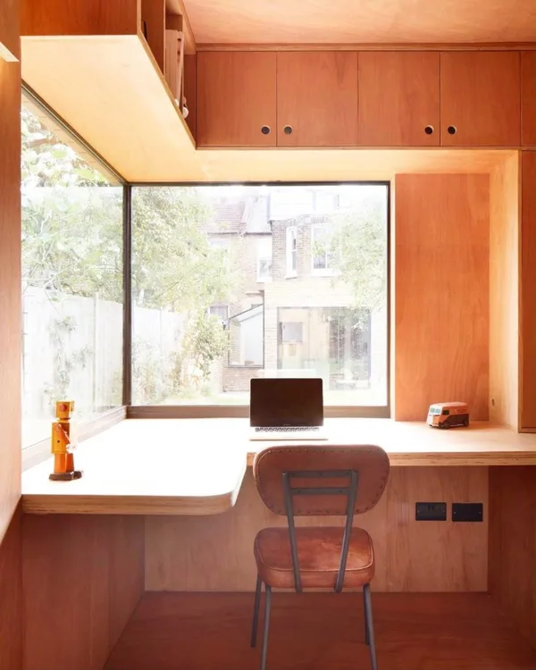 Bespoke wooden desk joinery and windows view