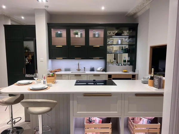 Bespoke kitchen counter range and hob layout with open shelving